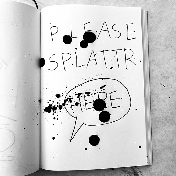 please splatter here in sketchbook with ink splatters
            on it